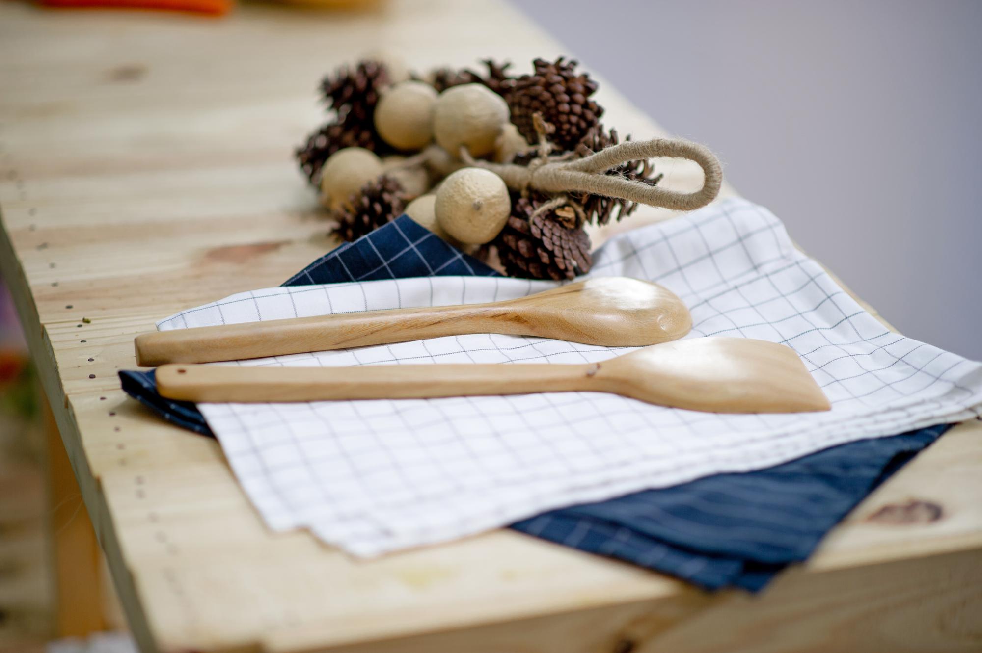 Small culinary workshop kitchen with wooden table